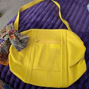 Vibrant Yellow Shoulder Bag with Patterned Scarf